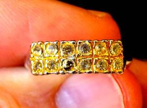 lot 132 image: GOLD FINISH RING WITH GEM STONES