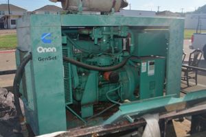 lot 2 image: Onan Generator. Ran 3 months prior to disconnect.  Hail Insurance Claim item.