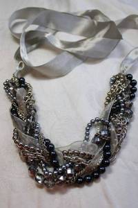 lot 57 image: Multi strand glass bead, metal bead and fabric torsade style adjustable necklace with grey silk ties. Necklace part 8L, Ties 38L