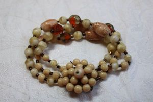 lot 58 image: Vintage West German ivory and cream 3-strand bracelet with decorated hidden insert clasp. Marked West German (1949-1990) on back of clasp. 8L