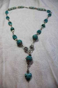 lot 64 image: Teal glass and crystal decorated Y- necklace with teal heart pendant. Lobster clasp. 20L