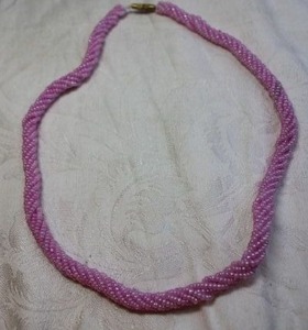 lot 67 image: Pink bead torsade style necklace with barrel clasp. 18L