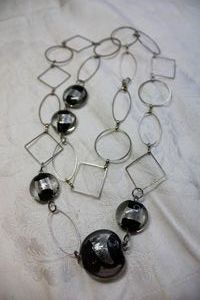 lot 68 image: Geometric shape metal necklace with silver and black glass satellite beads. Lobster clasp. 28L