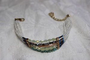 lot 69 image: Faceted glass bead and faux pearl multi strand bracelet. Lobster clasp. Adjustable from 7-9L.