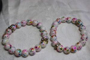 lot 71 image: (2) Funfetti or confetti (AKA Birthday Cake) glass bead stretch bracelets.