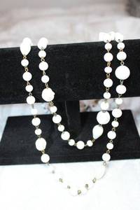 lot 77 image: Vintage milk glass molded bead necklace on bronze finish chain. Fold over clasp. 58L