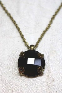 lot 85 image: Prong set Garnet glass pendant on gold finish cable chain necklace. 18L with 2 extender. Pendant about 1.25L