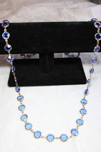 lot 89 image: Faceted round blue disc continuous rope necklace. 38L