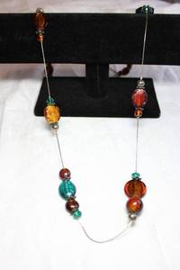 lot 96 image: Flat oval glass disc station bead necklace on silver finish box chain necklace. 36L with 2 extender. Lobster clasp.