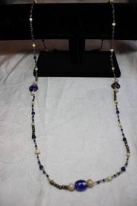 lot 142 image: Artisan crafted necklace with micro glass and bone beads with specialty art glass stations. 38L