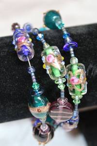 lot 143 image: Artisan crafted spiral bracelet with vintage Italian Venetian lampwork beads including Italian Venetian wedding cake glass beads.