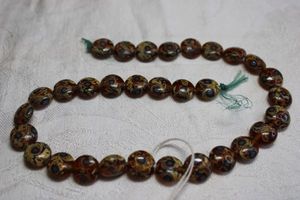 lot 146 image: Specialty vintage glass bead string. 15L  (31 beads)