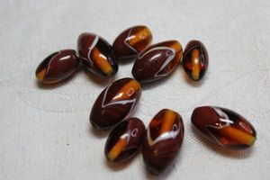 lot 148 image: Specialty vintage Amber glass beads (9 count)