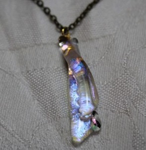 lot 155 image: Foil iridescent glass pendant on 18L flat cable chain necklace Spring ring clasp. Pendant about 2L