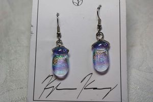 lot 161 image: Signed Kyle Wrangel Kinsey (Seattle, WA 2004 - ) dichroic and fused glass ear wire earrings on branded card. Earrings 1.75L