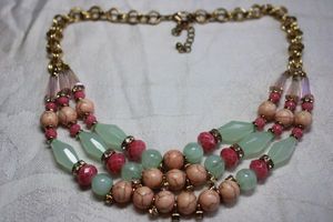 lot 113 image: Faceted green tube and Howlite style round bead necklace with gold finish espiga chain. 16L with 3 extender. Lobster clasp.