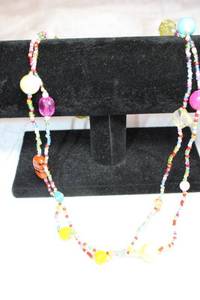 lot 115 image: Artisan crafted micro glass bead continuous necklace with larger primary hue color glass station beads. 46L