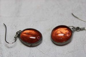 lot 121 image: Artisan crafted tangerine color glass cabochon French ear wire earrings with hand soldered silver frames. 1.5L