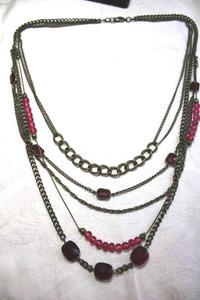 lot 124 image: Vintage bronze color layered necklace with deep redpurple glass stations. 22L Lobster clasp. Overall length of necklace 28L