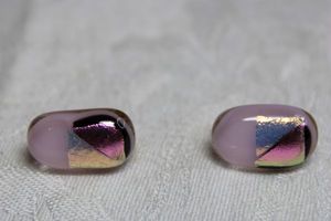 lot 130 image: Dichroic glass pink and black clip earrings with metallic transfer. 34L approx.