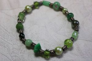 lot 134 image: Stretch bead bracelet with VenetianCzech lampwork beads.