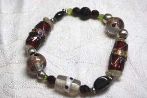 lot 139 image: Stretch bracelet with VenetianCzech lampwork glass beads.