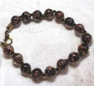 lot 140 image: VenetianCzech specialty glass bead bracelet and hand tied knot spacers. Lobster clasp. 7.5L