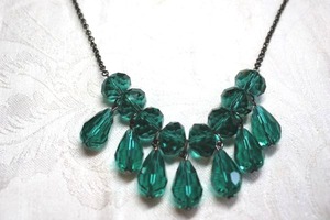 lot 179 image: Faceted teal blue and green incorporated briolette pendant necklace. 16L with lobster clasp