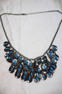lot 185 image: Faceted blue pear shape dangle antiqued metal necklace. Mimics Peacock feathers. 18L with 2 extender.