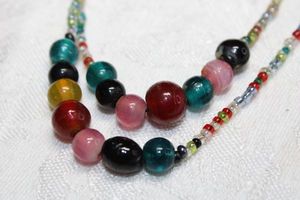 lot 187 image: Multi color micro glass continuous necklace with multi color glass beads. 58L