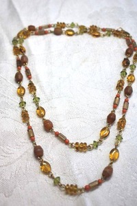 lot 193 image: Vintage yellow, orange, light green station necklace with wood bead accents on gold finish chain. Lobster clasp. 28L