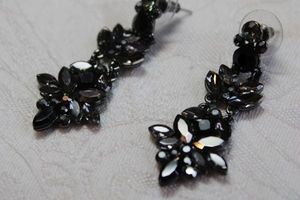 lot 198 image: Faceted metallic black and clear dangle poststud earrings with marquise and round shapes. 2L