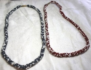 lot 199 image: (2) Artisan crafted micro glass bead necklaces with barrel clasp. Red and white and black and white. Both 16L