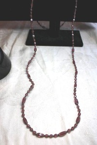 lot 200 image: Faceted Amethyst glass bead necklace with Marquise and diamond shapes. Barrell clasp. 36L