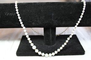 lot 213 image: Classic graduated opalescent glass bead necklace with gold ball separators. Barrel clasp. 22L