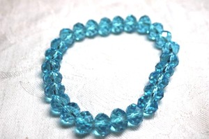 lot 215 image: Robins egg blue faceted glass bead stretch bracelet.