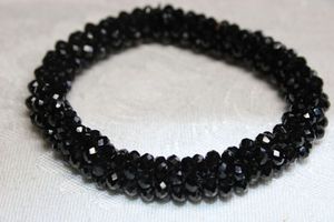 lot 218 image: Classic timeless black glass micro bead stretch bracelet