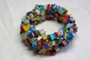 lot 226 image: Multi strand glass chip bead wide bracelet. 1.25W Has several types of millefiori and cane style bead chips.
