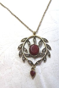 lot 238 image: Bronzed pendant with faceted red glass and rhinestones on a cable chain necklace. 22L with 2 extender. Pendant 2L