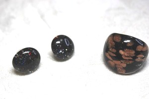 lot 244 image: Dichroic art glass black gold copper wide ring. Size 7. Includes a pair of black glitter glass button earrings. About 12W