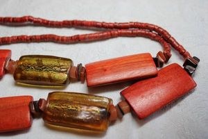 lot 246 image: Elongated gold foil glass rectangular bead and stained red wood bead continuous necklace with red wood bead yoke. 34L