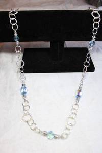 lot 248 image: High polish silver finish textured link continuous necklace with faceted blue AB quality bicone glass stations. 30L