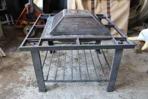 lot 46 image: Metal Patio table with tile top and square mesh food cover (legs need attention or tightened)
