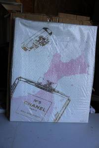 lot 259 image: Canvas art of Chanel No.5  - 24x30 (frame needs some attention)