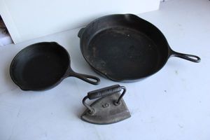 lot 271 image: Cast Iron Skillets. (1) 12 (1) 8 Plus Sad Iron