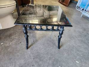 lot 65 image: Square cast table with glass black top