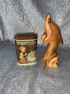 lot 32 image: Decor carved dolphins and a Hersheys nice tin