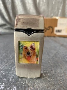 lot 121 image: Vintage lighter flip top with changing image of dogs