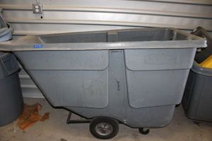 lot 75 image: Rubbermaid Rolling Plastic Dumpster, see photos.