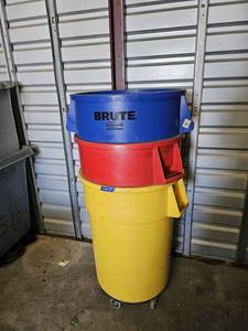 lot 5 image: Blue, Red, and Yellow Brute Trash Containers with round rolling dolly